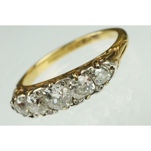 4 - Early 20th century diamond five stone yellow gold and platinum set ring, five graduated old round br... 