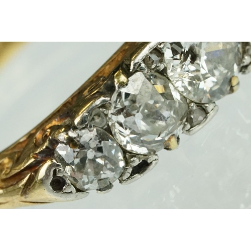 4 - Early 20th century diamond five stone yellow gold and platinum set ring, five graduated old round br... 