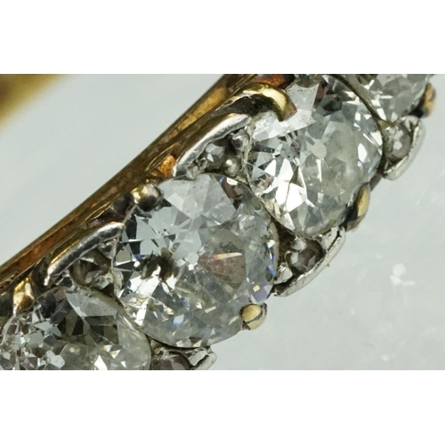 4 - Early 20th century diamond five stone yellow gold and platinum set ring, five graduated old round br... 