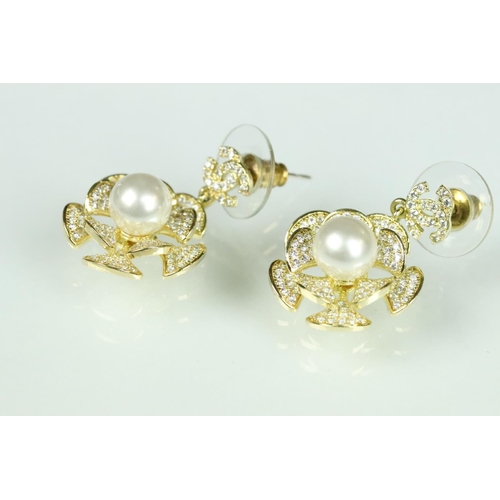 40 - Pair of Chanel costume jewellery earrings having crossed C's to the heads with floral drops suspende... 