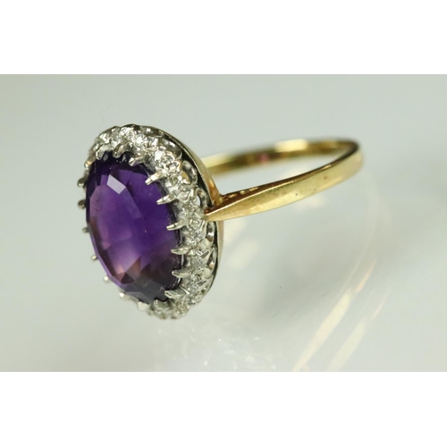 43 - Amethyst and diamond dress ring having a large oval cut amethyst to the centre set with a halo of ro... 