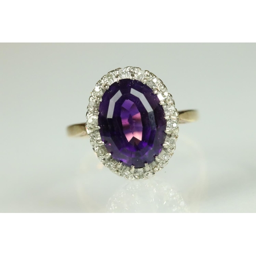 43 - Amethyst and diamond dress ring having a large oval cut amethyst to the centre set with a halo of ro... 