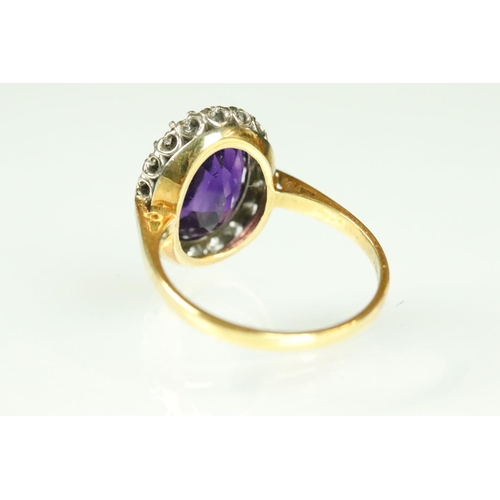 43 - Amethyst and diamond dress ring having a large oval cut amethyst to the centre set with a halo of ro... 