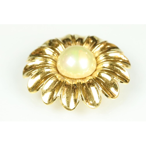 50 - Chanel costume jewellery flower brooch having a large simulated pearl to the centre with gilt petals... 