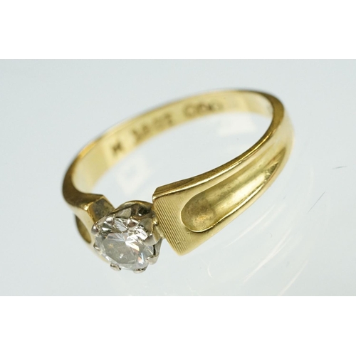 52 - Diamond solitaire 18ct yellow and white gold set ring, the round brilliant cut diamond weighing appr... 