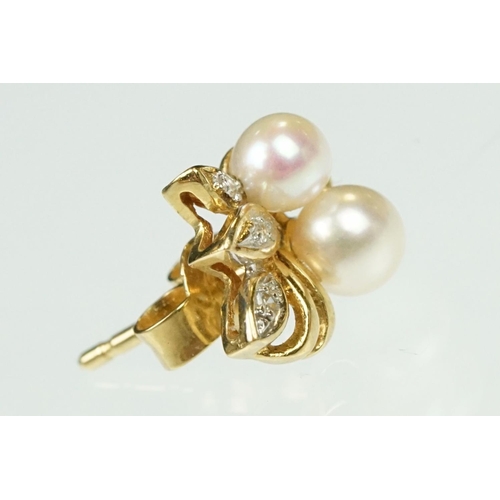 54 - Pair of cultured pearl and diamond yellow metal stud earrings, two cream cultured pearls with pink o... 