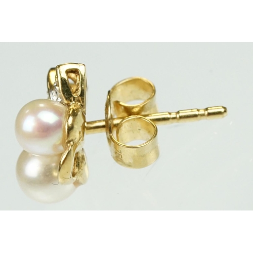 54 - Pair of cultured pearl and diamond yellow metal stud earrings, two cream cultured pearls with pink o... 