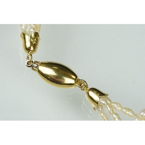 55 - Freshwater pearl three strand necklace with 18ct yellow gold hook and box clasp, length approx 46cm,... 