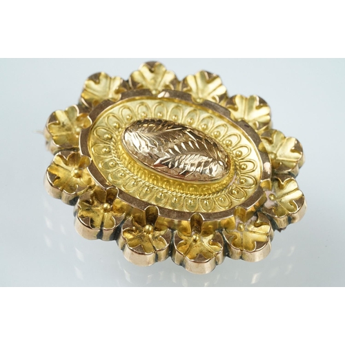 58 - 19th century 9ct gold stepped oval brooch, embossed foliate decoration, bead and rope twist detailin... 