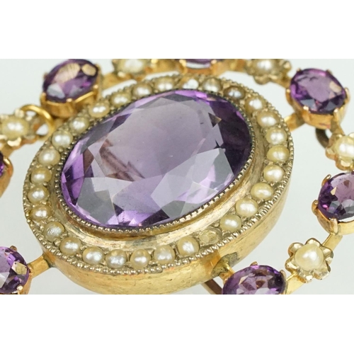 64 - Early 20th century amethyst and seed pearl yellow metal pendant brooch, the principal amethyst measu... 