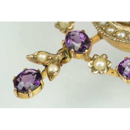 64 - Early 20th century amethyst and seed pearl yellow metal pendant brooch, the principal amethyst measu... 