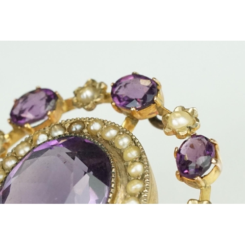 64 - Early 20th century amethyst and seed pearl yellow metal pendant brooch, the principal amethyst measu... 