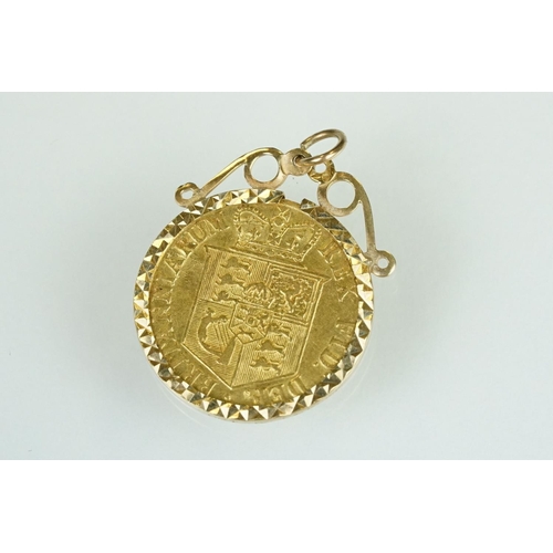 67 - George III half guinea coin pendant, the half guinea dated 1817, shield back, yellow metal mount