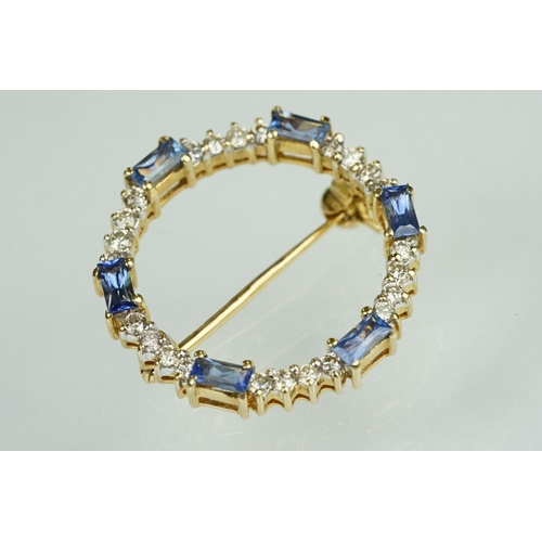 68 - Sapphire and diamond 18ct yellow gold wreath brooch, six baguette cut sapphires, dimensions approx 2... 