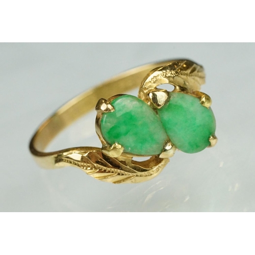 70 - Jade 22ct yellow gold two stone ring, two pear shaped cabochon cut jade panels, dimensions approx 6.... 