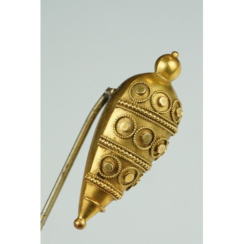 72 - 19th century yellow metal stick pin, the Etruscan Revival tapered head with bead and rope twist deta... 