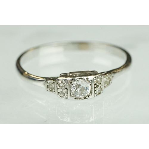 75 - Art Deco diamond solitaire white metal ring, the round old cut diamond weighing approx 0.15 carat, c... 