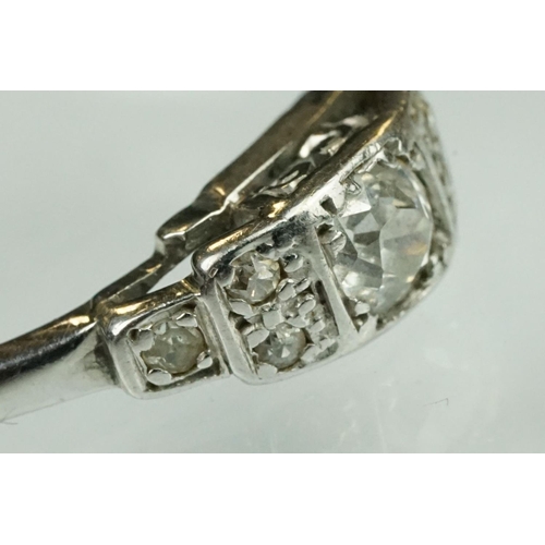 75 - Art Deco diamond solitaire white metal ring, the round old cut diamond weighing approx 0.15 carat, c... 