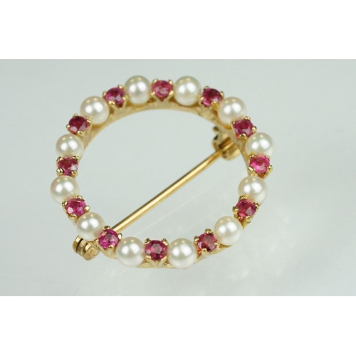 76 - Ruby and cultured pearl 9ct yellow gold brooch, small round cut rubies, claw set, small round white ... 