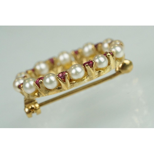 76 - Ruby and cultured pearl 9ct yellow gold brooch, small round cut rubies, claw set, small round white ... 