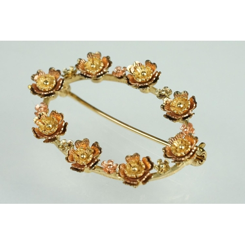 77 - 9ct yellow and rose gold oval brooch, flower head design, dimensions approx 2.5cm x 3.5cm