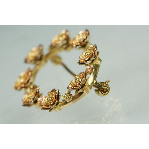 77 - 9ct yellow and rose gold oval brooch, flower head design, dimensions approx 2.5cm x 3.5cm