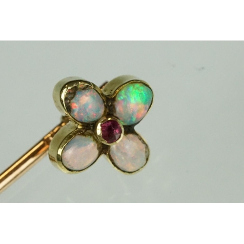 79 - Opal and garnet quatrefoil flower head yellow and rose metal stick pin, four oval cabochon cut preci... 