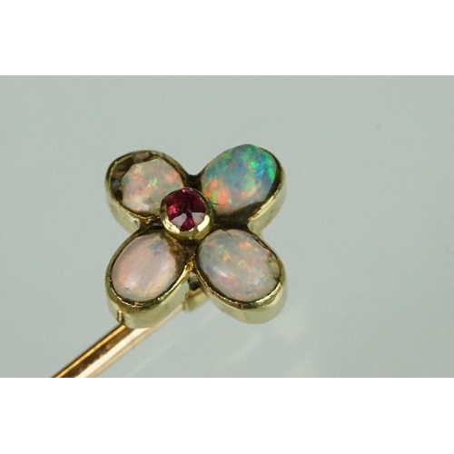 79 - Opal and garnet quatrefoil flower head yellow and rose metal stick pin, four oval cabochon cut preci... 