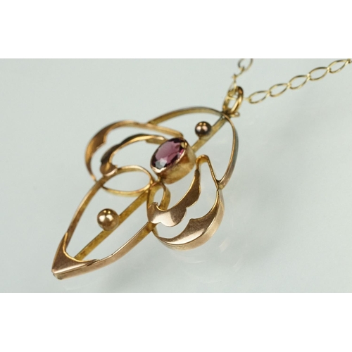 82 - Art Nouveau garnet 9ct rose gold pendant, the oval mixed cut garnet measuring approx 4.5mm x 3.5mm, ... 