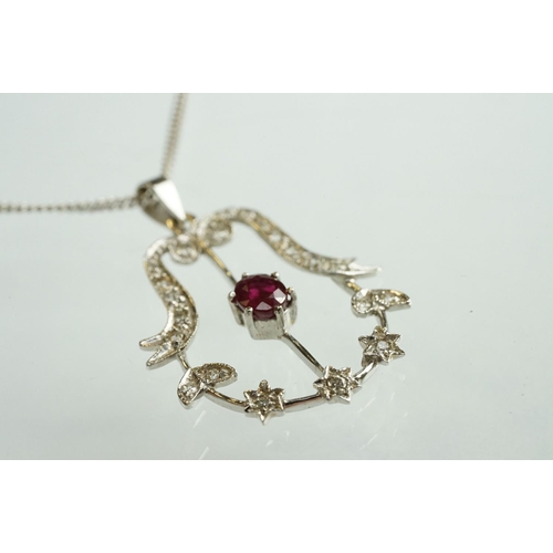 83 - Ruby and diamond 18ct white gold pendant necklace, the central oval mixed cut ruby measuring approx ... 