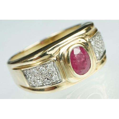 89 - Ruby and diamond 9ct yellow gold ring, oval mixed cut ruby measuring approx 7mm x 5mm, rubover set, ... 