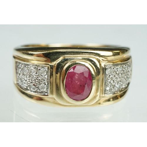 89 - Ruby and diamond 9ct yellow gold ring, oval mixed cut ruby measuring approx 7mm x 5mm, rubover set, ... 