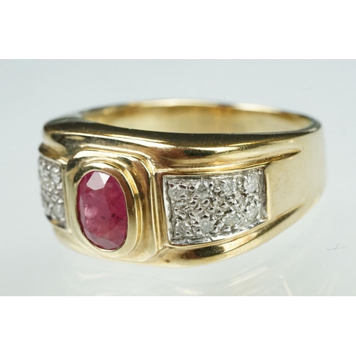 89 - Ruby and diamond 9ct yellow gold ring, oval mixed cut ruby measuring approx 7mm x 5mm, rubover set, ... 