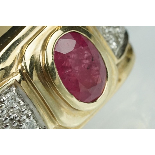 89 - Ruby and diamond 9ct yellow gold ring, oval mixed cut ruby measuring approx 7mm x 5mm, rubover set, ... 