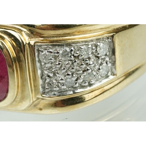 89 - Ruby and diamond 9ct yellow gold ring, oval mixed cut ruby measuring approx 7mm x 5mm, rubover set, ... 