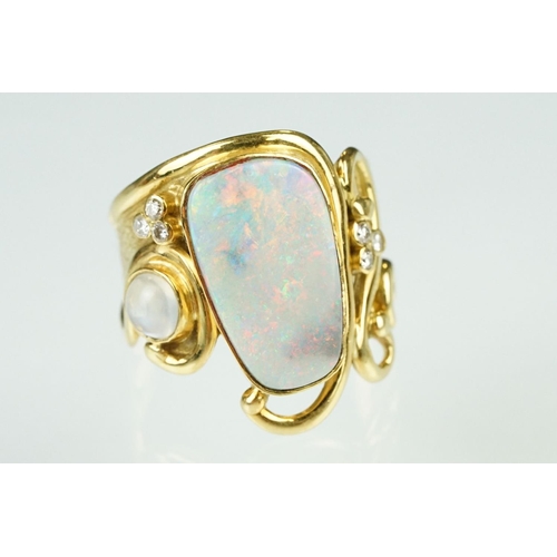 9 - Opal, moonstone and diamond 18ct yellow gold ring, the precious white opal displaying indigo, blue, ... 