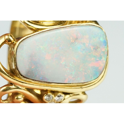 9 - Opal, moonstone and diamond 18ct yellow gold ring, the precious white opal displaying indigo, blue, ... 