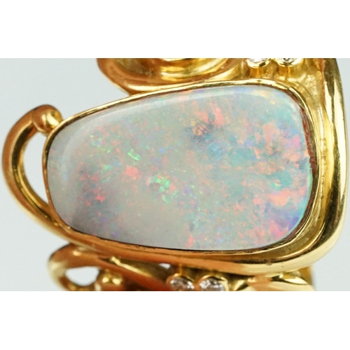 9 - Opal, moonstone and diamond 18ct yellow gold ring, the precious white opal displaying indigo, blue, ... 