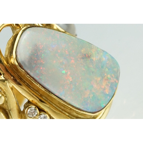 9 - Opal, moonstone and diamond 18ct yellow gold ring, the precious white opal displaying indigo, blue, ... 