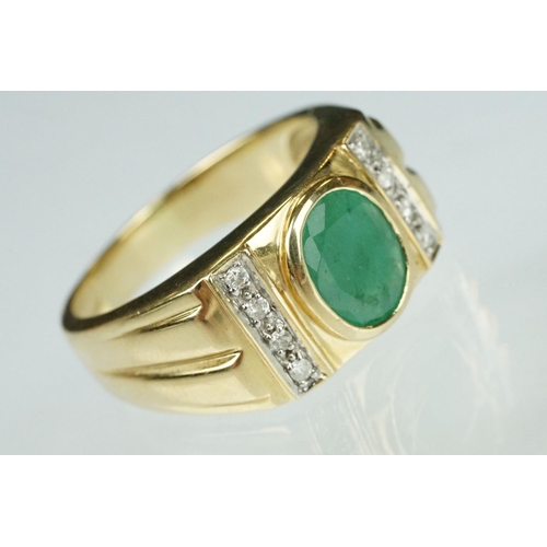 91 - Emerald and diamond 9ct yellow gold Gents ring, the oval mixed cut emerald measuring approx 9mm x 7m... 