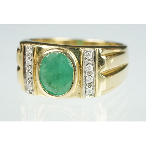 91 - Emerald and diamond 9ct yellow gold Gents ring, the oval mixed cut emerald measuring approx 9mm x 7m... 