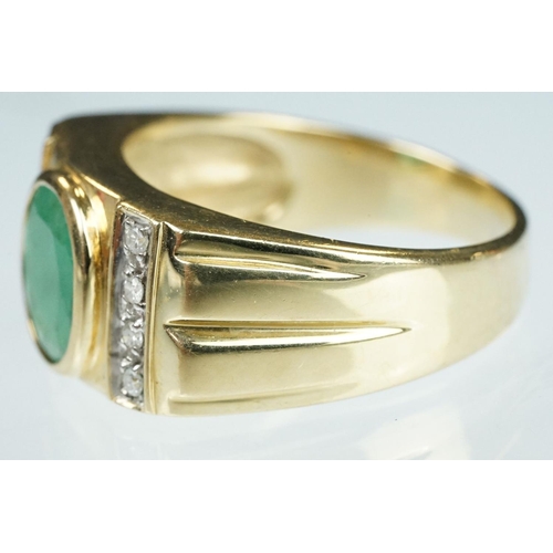 91 - Emerald and diamond 9ct yellow gold Gents ring, the oval mixed cut emerald measuring approx 9mm x 7m... 