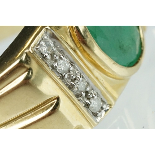 91 - Emerald and diamond 9ct yellow gold Gents ring, the oval mixed cut emerald measuring approx 9mm x 7m... 