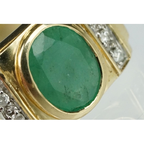 91 - Emerald and diamond 9ct yellow gold Gents ring, the oval mixed cut emerald measuring approx 9mm x 7m... 