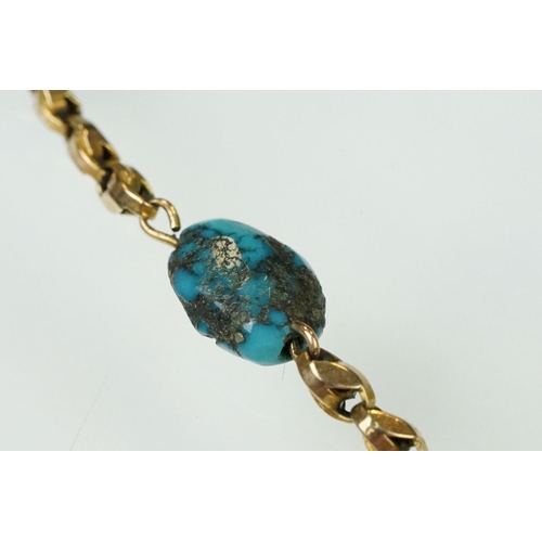 92 - Early 20th century turquoise and yellow metal necklace, eleven asymmetric rough turquoise beads, fan... 