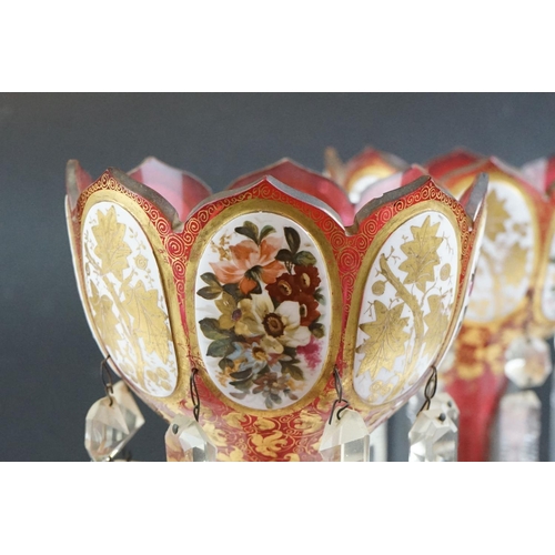 11 - Pair of 19th Century Victorian cranberry glass lustres, each having scalloped rims with floral panel... 