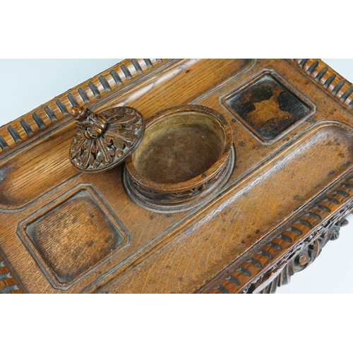 13 - Early 20th Century Edwardian carved oak ink stand having carved foliate detailing with an armorial c... 