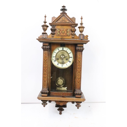 188 - An antique wooden cased wall clock with brass and enamel dial, Roman numeral markers, complete with ... 