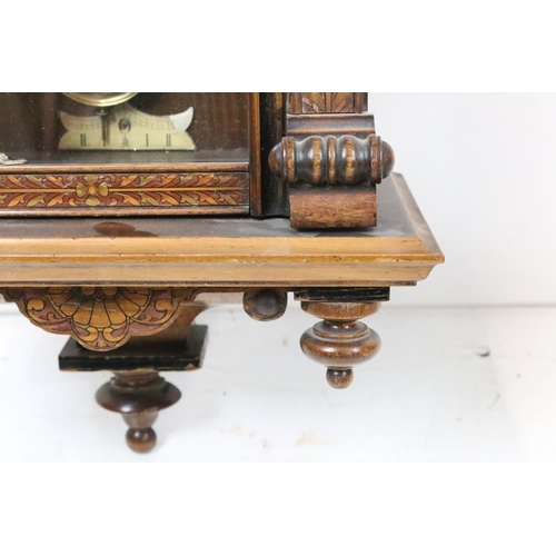 188 - An antique wooden cased wall clock with brass and enamel dial, Roman numeral markers, complete with ... 