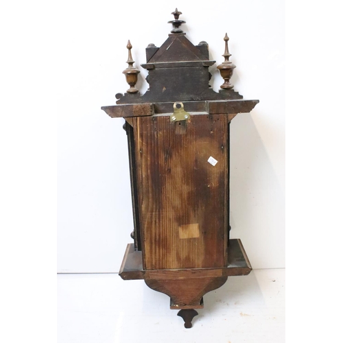 188 - An antique wooden cased wall clock with brass and enamel dial, Roman numeral markers, complete with ... 